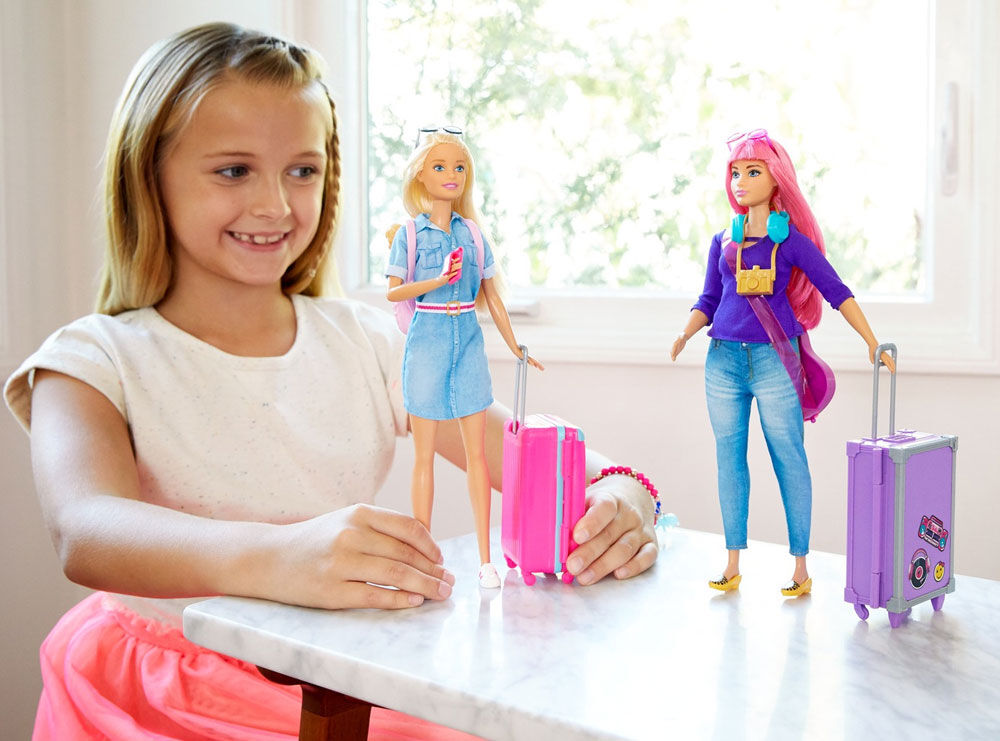 girl playing with barbie